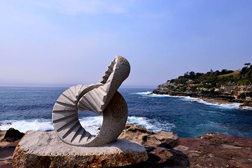 2 rings by Keizo Ushio Abstract sculpture perched on a cliff face