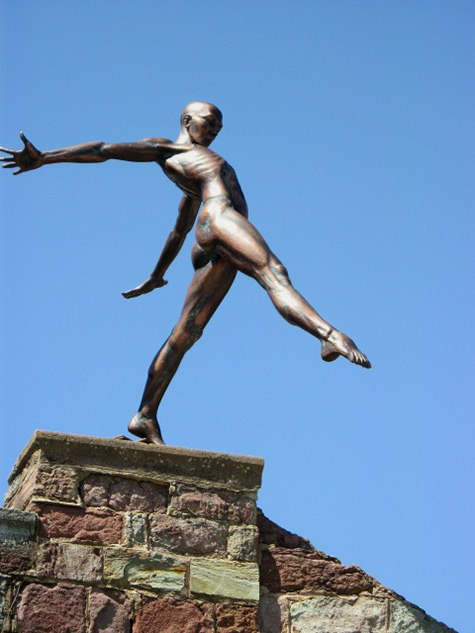 Henry Clews courtyard-sculpture of a male figure balancing on a rock platform
