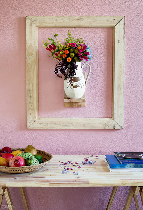 Jug on wall highlighted by frame 