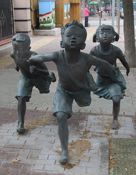 Street sculpture outside a school- n Qingdao
