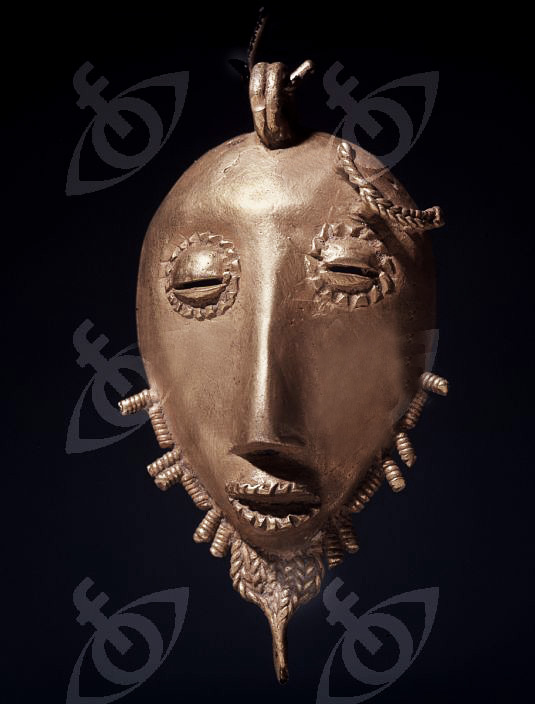 A gold pendant in the form of a stylized head. Country of Origin Ghana. Culture Ashanti.