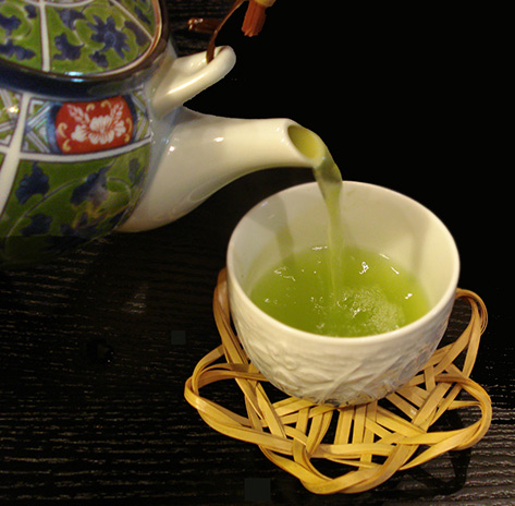 pouring Japanese green tea