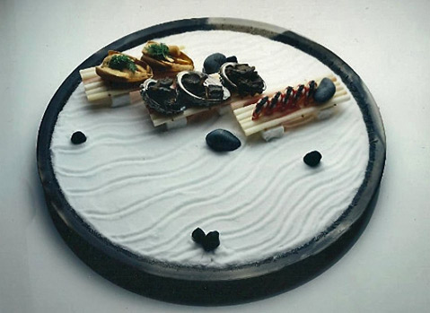 Jinnai Sakata - wavy white platter with black border with seafood