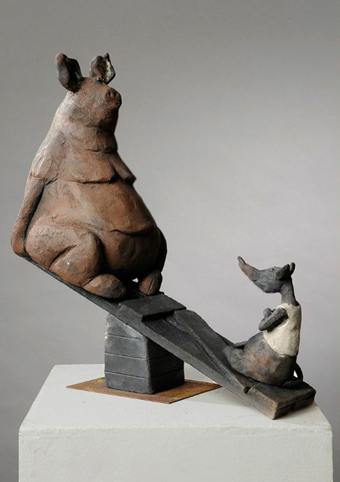 Galerie-Joelle-Gervais---La-balançoire A ceramic mouse and pig sitting on a see saw