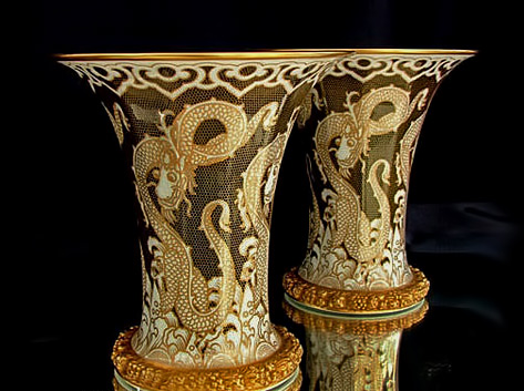 Large pair of Rosenthal Art Deco Vases –with dragons surrounded by honeycomb pattern gilding and the large flared rim with gilded edge and gilded ornately patterned border within.