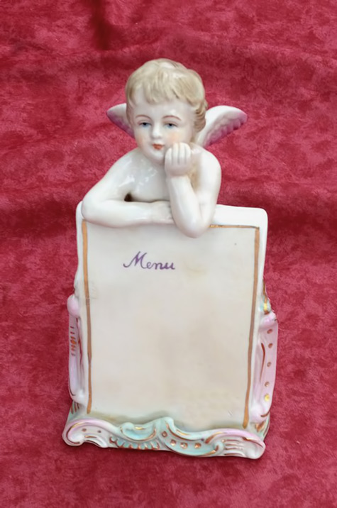 French porcelain menu with an angel