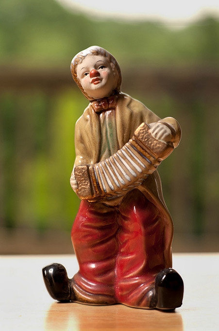 Figurine of a clown playing a squeezebox-Matt Prince