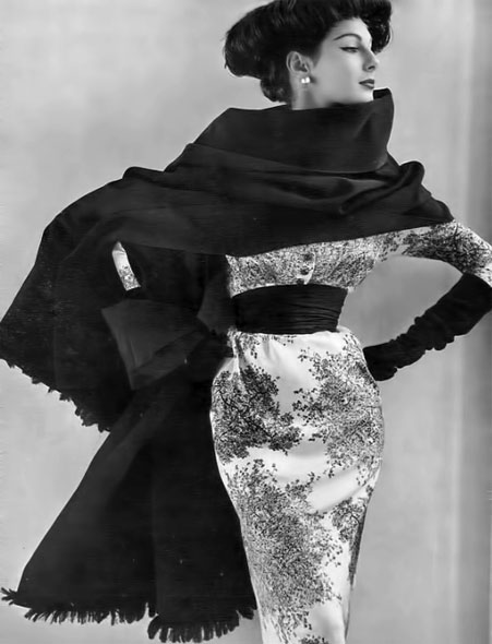 Fiona-Campbell-Walter-in-foliage-print-satin-sheath-with-black-taffeta-cummerbund-and-black-taffeta-fringed-stole-by-Jacques-Fath--Paris-Vogue--May-1952--