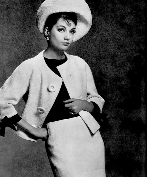 Model-in-white-wool-suit-with-black-wool-blouse-by-Capucci--photo-by-Georges-Saad--1961--