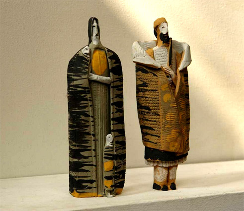 monumental totem figure sculptures in traditional Greek atire by Theodoros Papagiannis