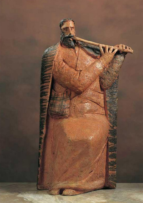 Terracotta sculpture of a musician playing the flute by Theodoros Papagiannis
