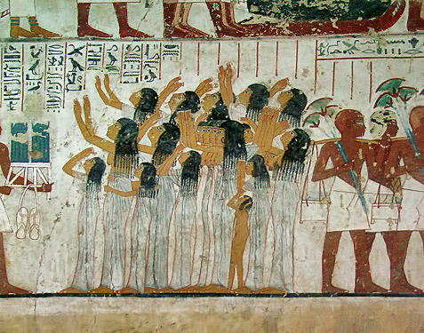 Egyptian wall relief of women at a funeral