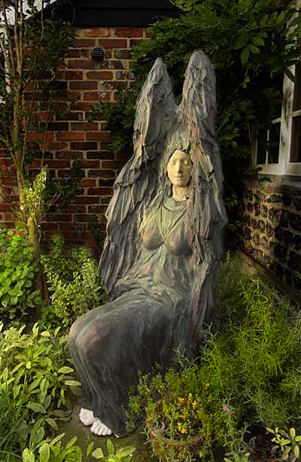 artpark_sculpture Ginger Gilmour - Seated Angel winged angel with closed eyes sitting in garden