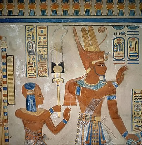 Detailed  wall painting in the tomb of Amen-hor-khepeshef. The son of Ramses III wearing the side-lock of youth stands behind the pharaoh.