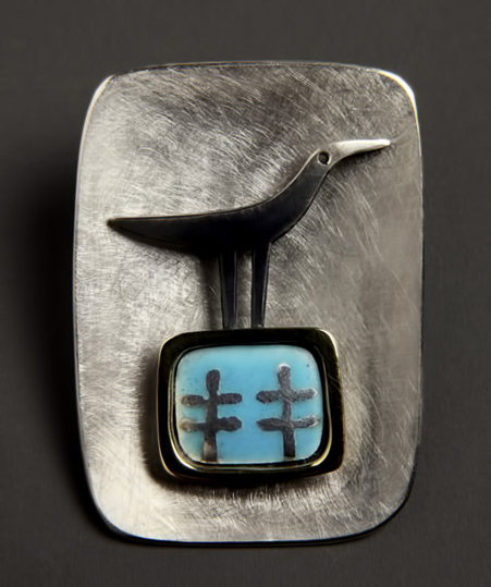 Alan-Ardiff,-Irish-jewelle-brooch Alan Ardiff,-Irish-jeweller.-One Fine Day -brushed metal brooch with bird motif
