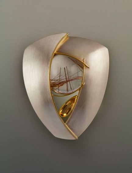 Trine'-brooch-by-Eleanor-Moty Trine'-brooch-by-Eleanor-Moty,-2002.-Sterling-silver,-22K-gold,-rutilated-quartz-and-topaz