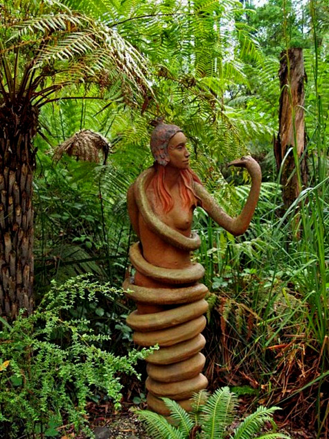 Bruno-Torfs,-sculpture-garden Sculpture of a woman coiled in a snake