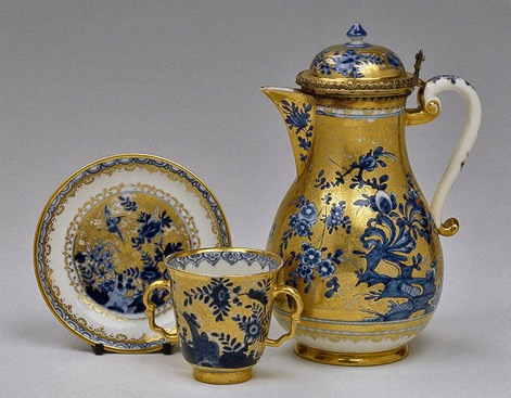 Coffee-Pot-with-Lid-Irminger,-J.J.-(model);-Adam,-Elias-(setting).-Germany,-Meissen.-Circa-1715-1735-Hermitage-Museum---Porcelain-and-silver;-underglaze-painting-and-gilding