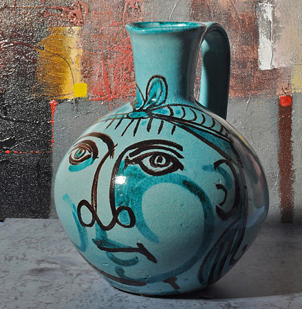 Guerrino Tramonti, Green ceramic pouring vessel with female face motif in black, Early 1950s