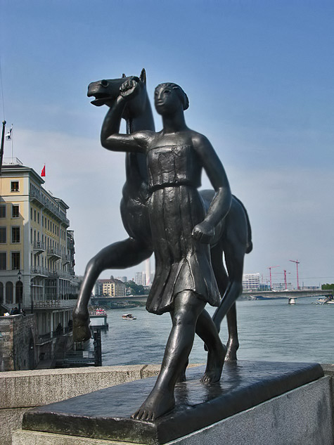 Basel,-Switzerland-Sculpture-by-Carl-Nathan-Burckhardt-called-Amazon,-Pferd-Führend-(An-Amazon-leading-a-horse)-Wayne-Hopkins-flickr--