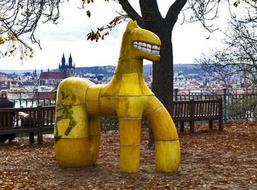 Abstract yellow dog sculpture by Alexandra-Koláčková, Prague