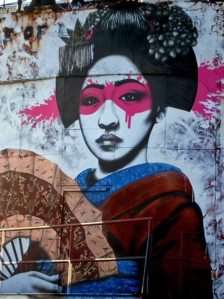 Street-Art-(on-a-rusty-ship-wreck)-by-Fin-DAC-in-North-Wales