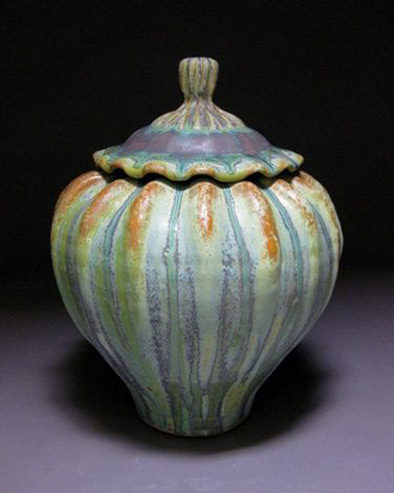Lidded-Jar,-ribbed-body,-waved-lid-with-ribbed-knob,-light-green-patina-with-terra-cotta-accents