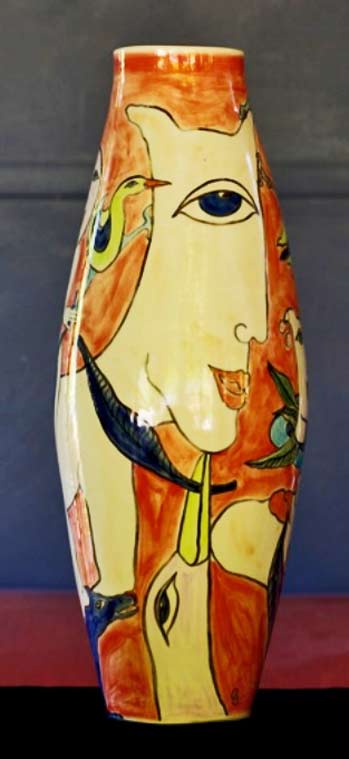 Ceramic ovoid vae with abstract face motif and birds www.ivyhill.com