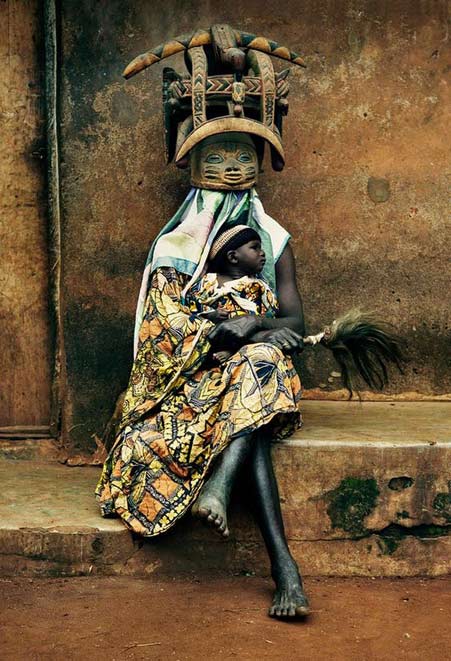 African-mask-woman holding a child- photo by David Paul Carr