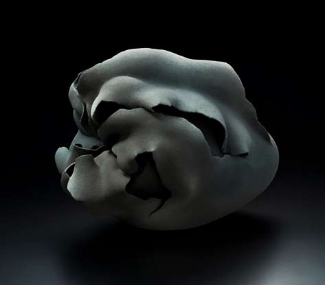 Interconnection-’15-4;-Flower-inspired-sculpture-with-curling-petal-like-folds-and-spray-glazed-in-matte-black-and-gray--