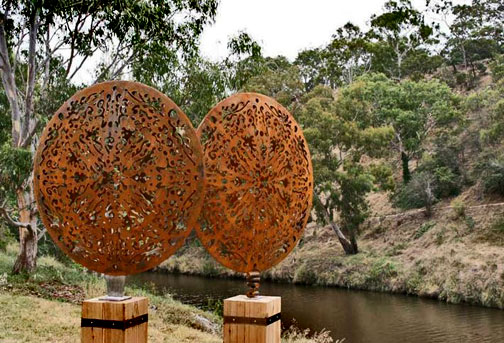 Sculptures-at-The-Flower-Garden-two-convex-laser-cut-disks-1200mm-diam-are-welded-together-to