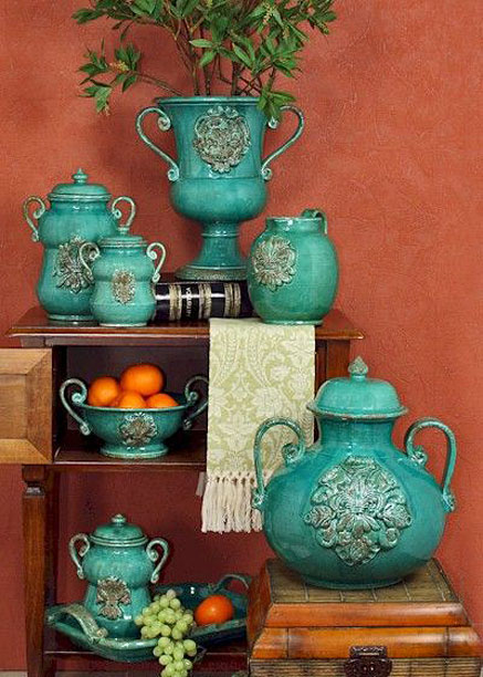 Artistica-Italian-Gallery Italian floral relief motif turquoise pottery against a deep salmon background