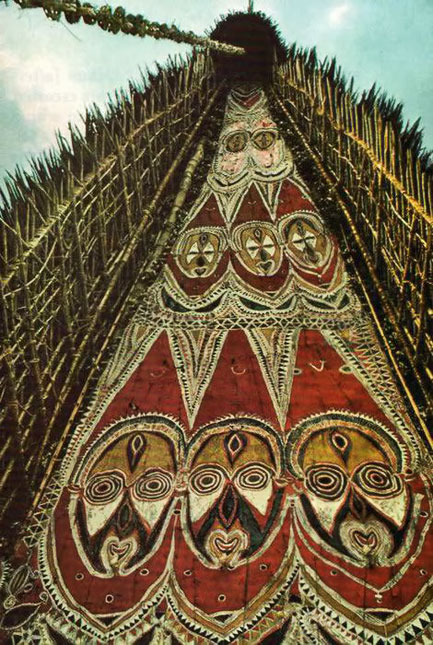 Spectral-gallery-of-spirit-faces-peers-from-the-upper-facades-of-haus-tambarans-in-the-Maprik-area-stoneage-cathederals