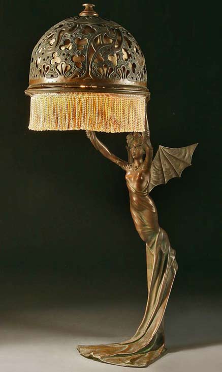 AN-ART-NOUVEAU-BRONZED-METAL-FIGURAL-TABLE-LAMP-probably-Austrian-circa-1900-of-a-winged-nymph,-after-a-model-by-R