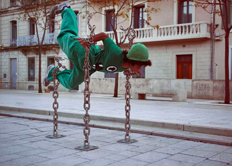 DIMITRI-DANILOFF photography -- girl balancing on a chain sculpture