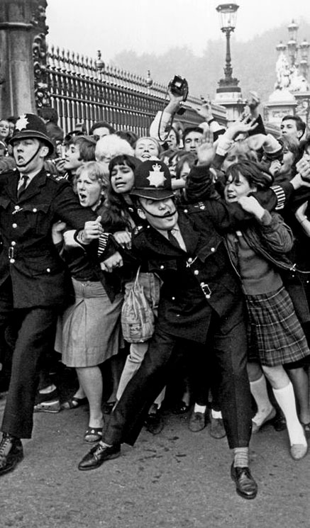 POLICE-STRUGGLING-TO-RESTRAIN-BEATLES-FANS-OUTSIDE-BUCKINGHAM-PALACE-IN-OCTOBER,-1965