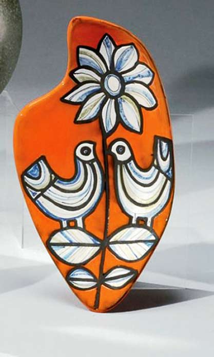 large-flat-ceramic-honeycomb-shape-decorated-with-birds-and-flowers-highlighted-on-orange-background-roger-capron