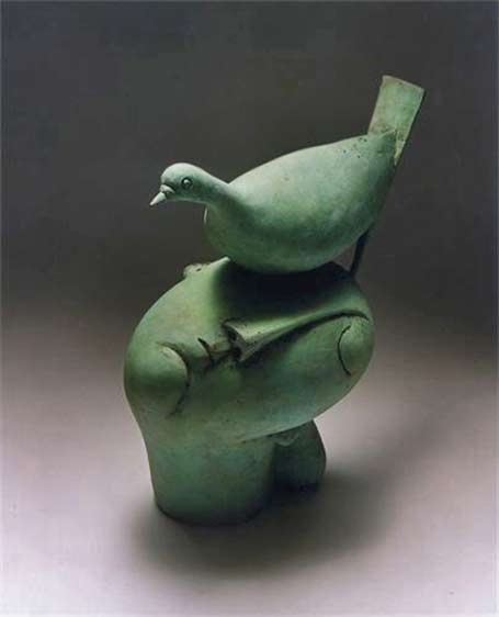 mourning-dove-by-peter-harskamp - green bird sitting on a mans head