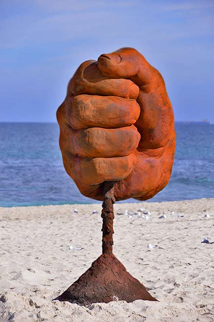 norton-flavel-dust-sculpture-by-the-sea-cottesloe-2016 large red fist holding dust