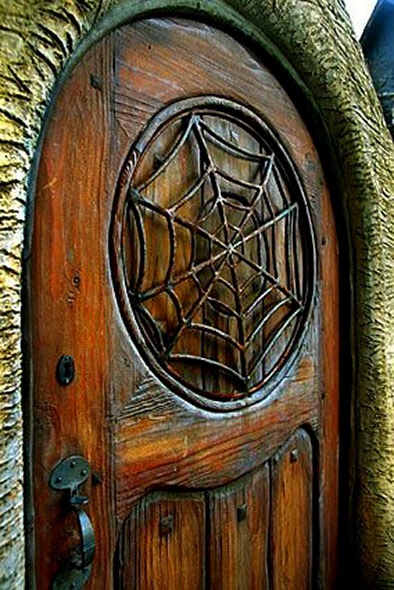 The outside spider web motif gate at Witches House in Beverly Hills.