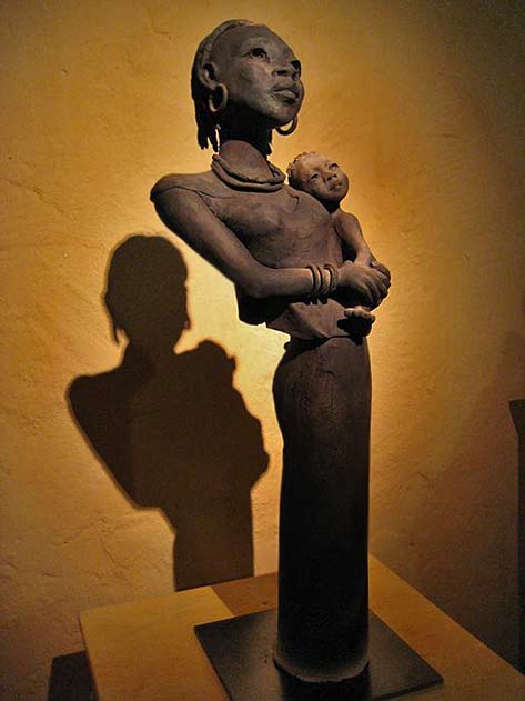 Michele-Ludwiczak African woman hoilding child sculpture