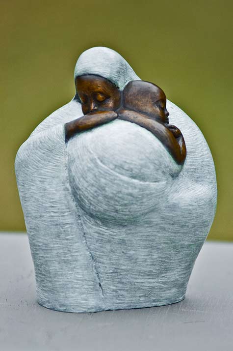 African mother holding baby by sculptor Nnamdi-Okonkwo