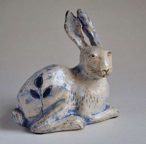 margaret-wozniak - blue highlights on a white ceramic rabbit