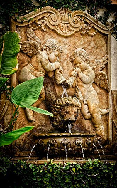 Two Cherubs and a lion head wall fountain