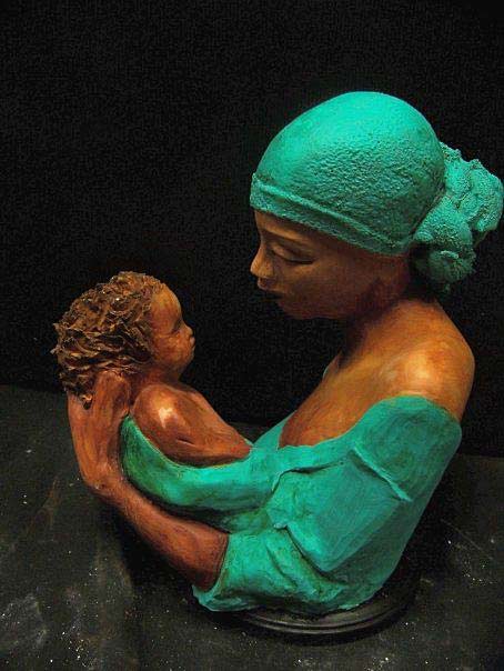 Woodruff Nash mother holding child bust - Women with green headscarf holding a baby