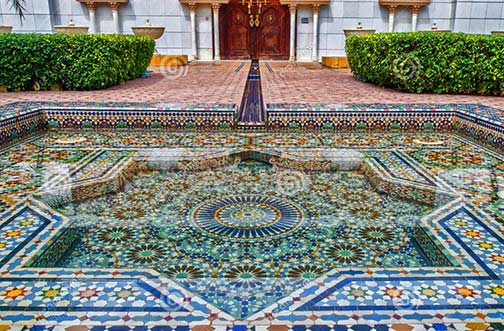 Moroccan tiled geometric pool fountain