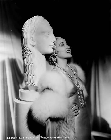 Genevieve-Tobin posing with white art deco bust