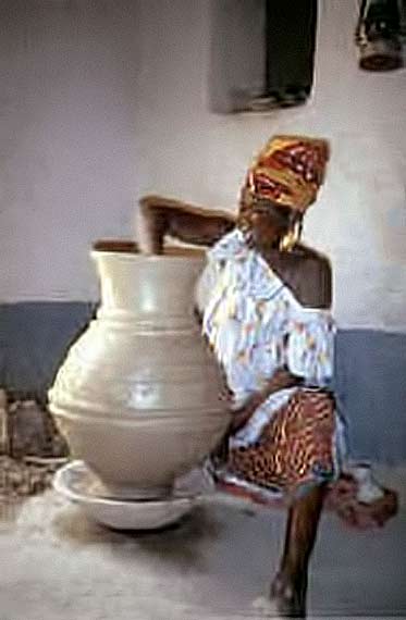African lady forming a large pot