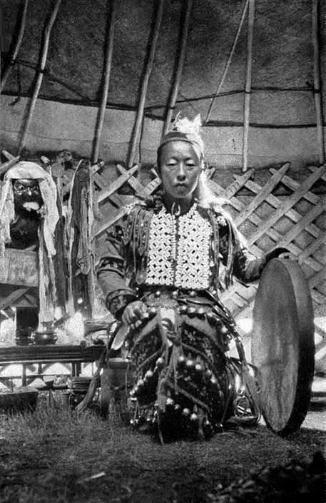 Dagur-female shaman-with-her-drum,-1931
