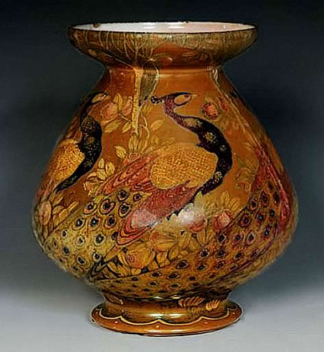 red, amber and black terracotta vessel by Galileo Chini